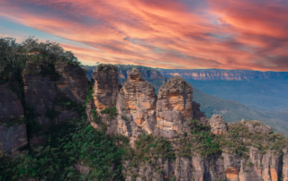 The three sisters in the Blue Mountains. Viewed at sunset with beautiful pink and orange hues in the sky.